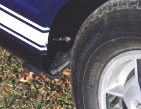 Remove the body bolts in the rear wheel wells